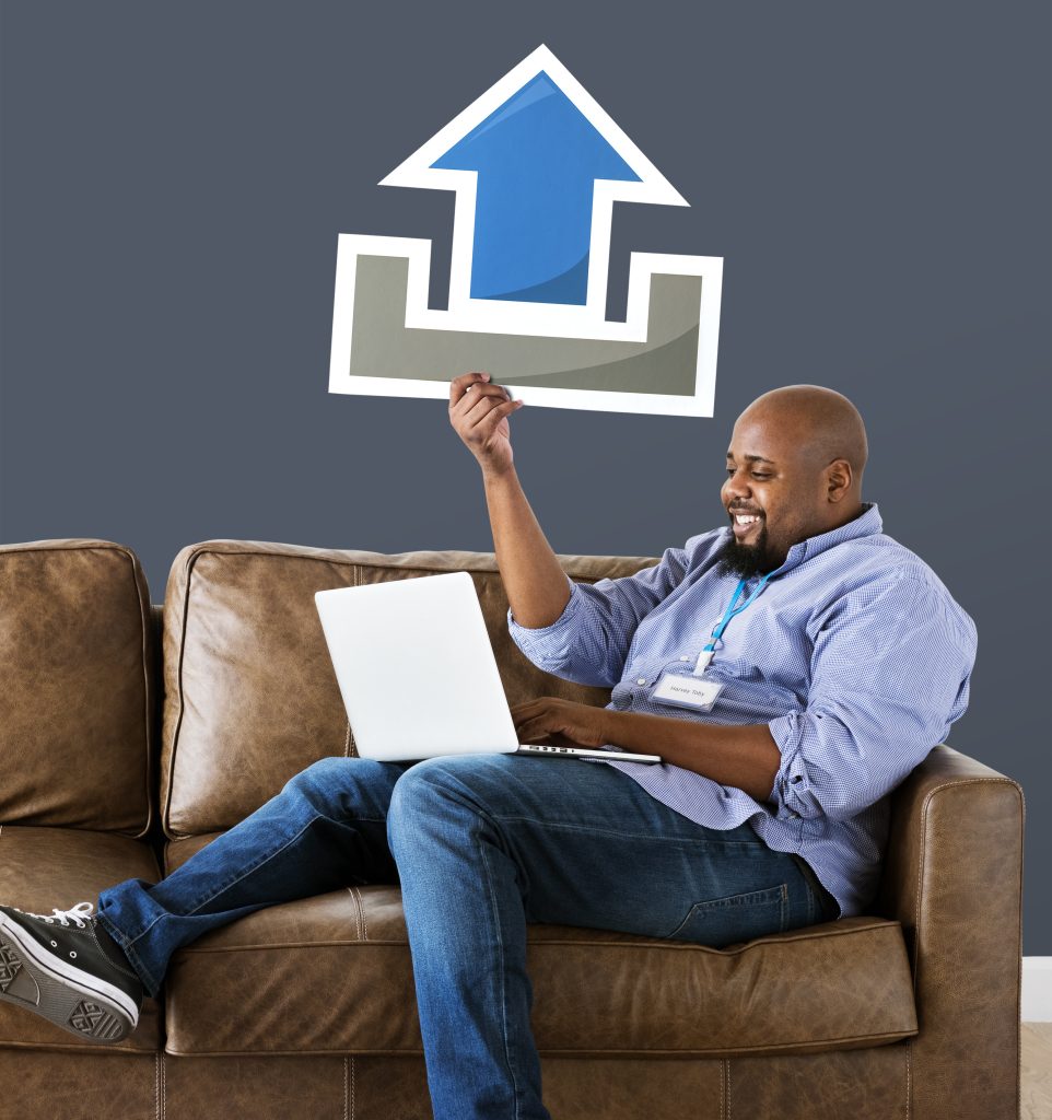 black man working on laptop